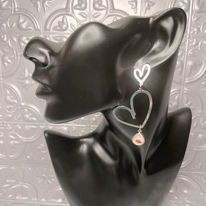 Silver Fluorescent heart shaped earrings,light weight brand new for pierced ears